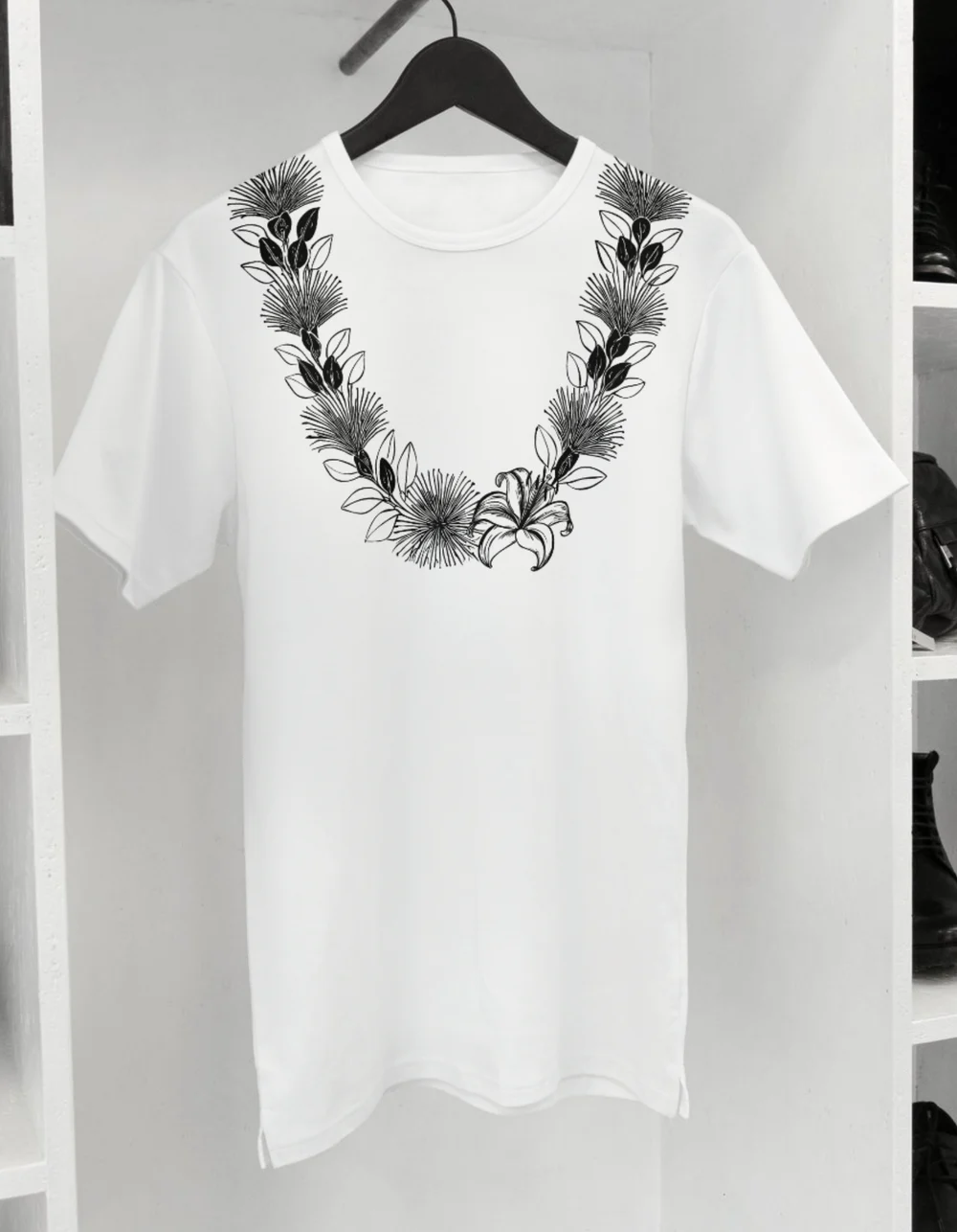 Early mockup of a white shirt with a decorative lei design.